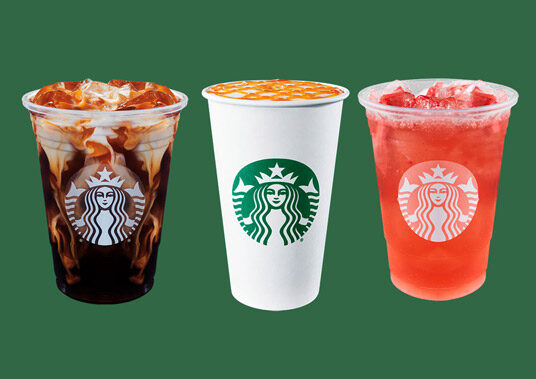 Three Starbucks drinks on a solid green background