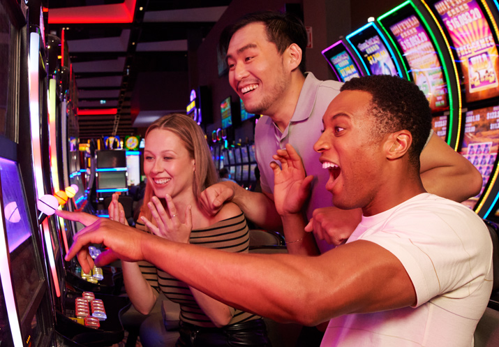 Friends winning at slot machine