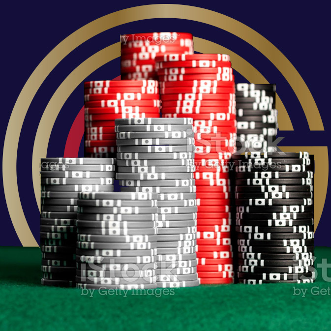 A pile of poker chips on a green background.