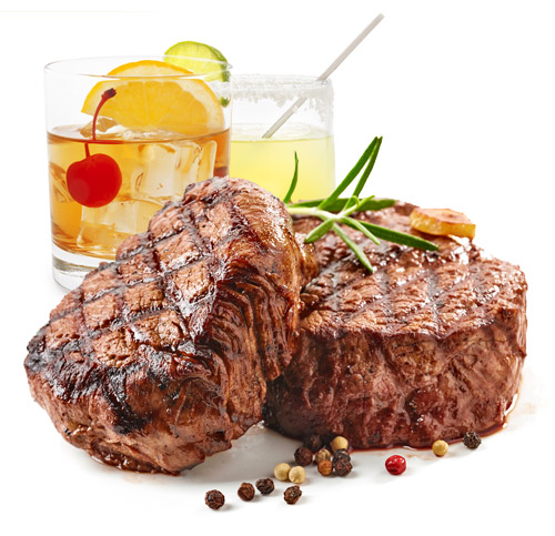 Delicious Steak with Cocktails behind it