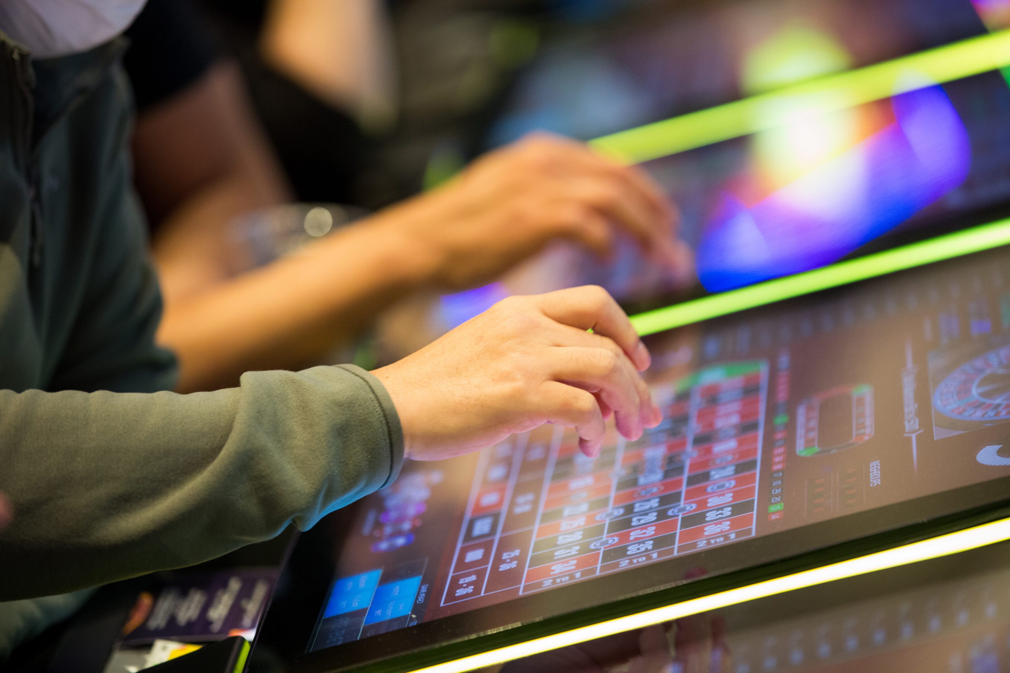 People Playing Electronic Table Games