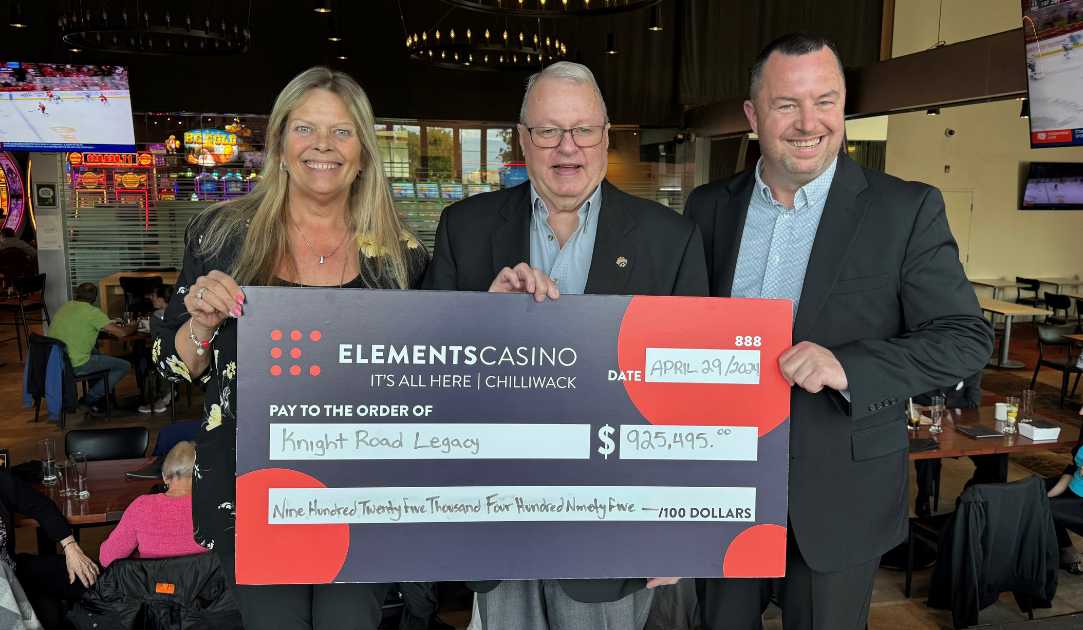 Rhonda Dyck, Director of Operations, Elements Chilliwack (left) and Michael Worth, Regional Vice President, Great Canadian Entertainment (right), present the cheque to Jerry Wernicke, President, Knight Road Legacy Association (centre)
